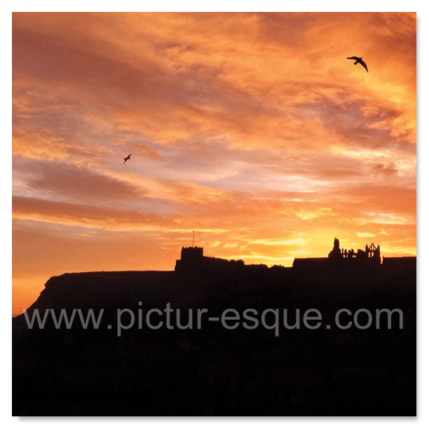 Sunrise over St Mary's Church and Whitby Abbey in North Yorkshire