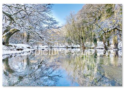 Reflections in a river on a clear winter day